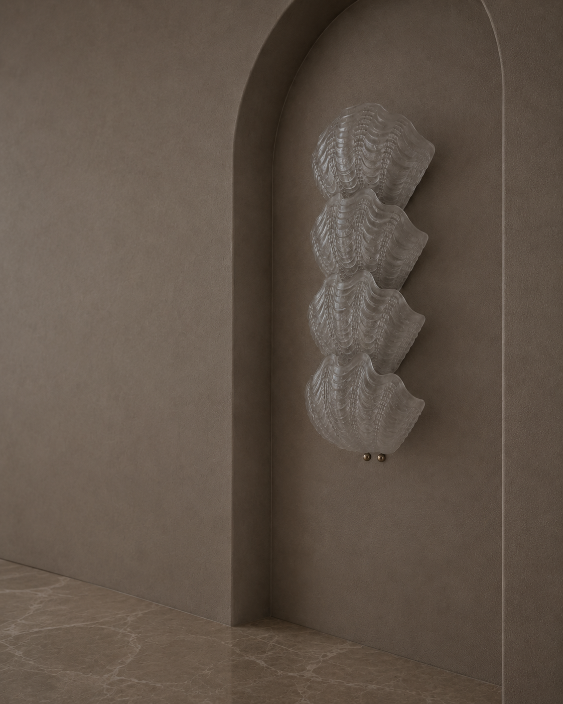 A modern sculptural wall sconce with four stacked textured, fan-like glass shades, mounted on a textured taupe plaster wall within a recessed archway.