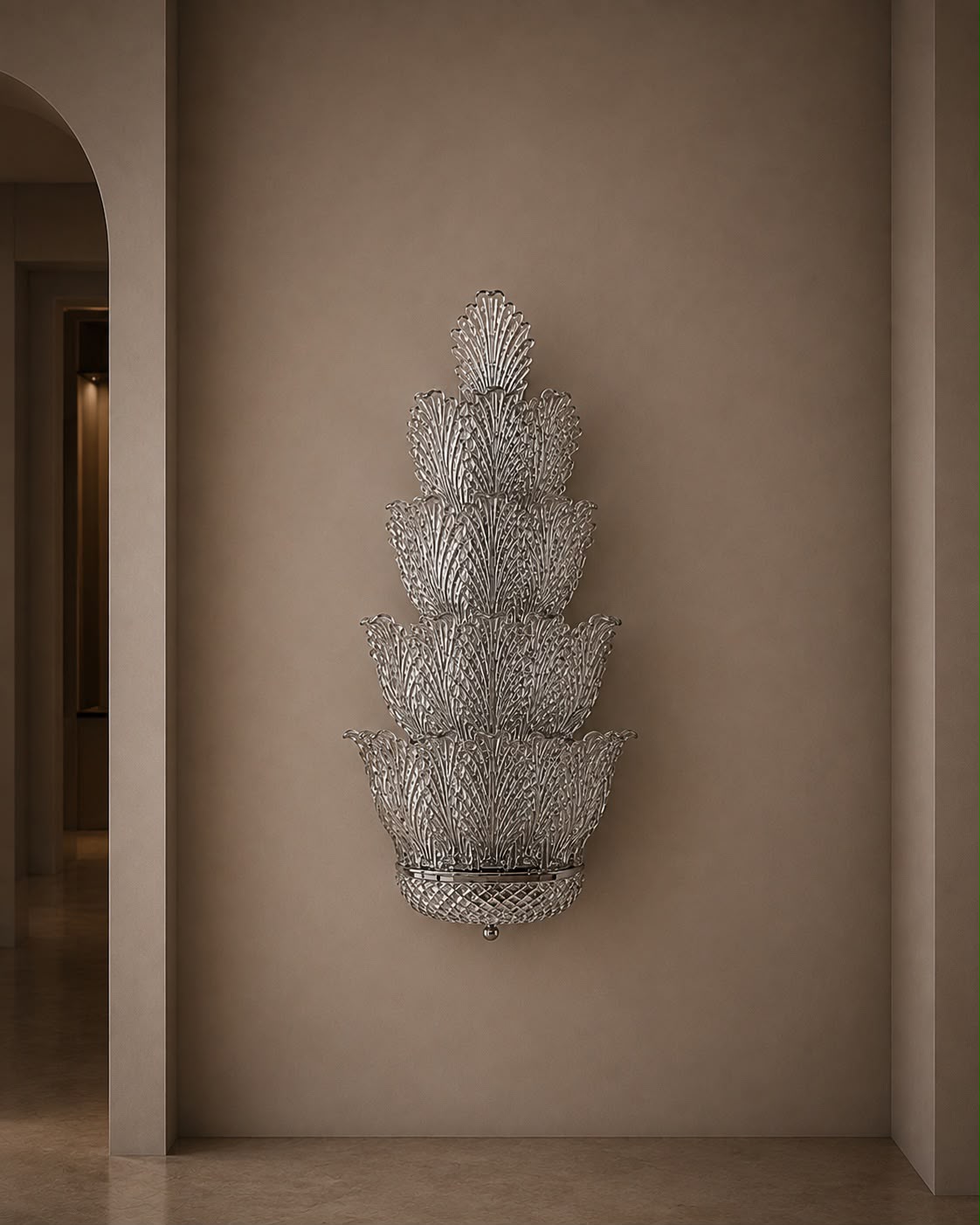 A tiered, lotus-shaped wall sconce with a textured silver mesh pattern, mounted on a warm beige plaster wall in an elegant interior hallway.