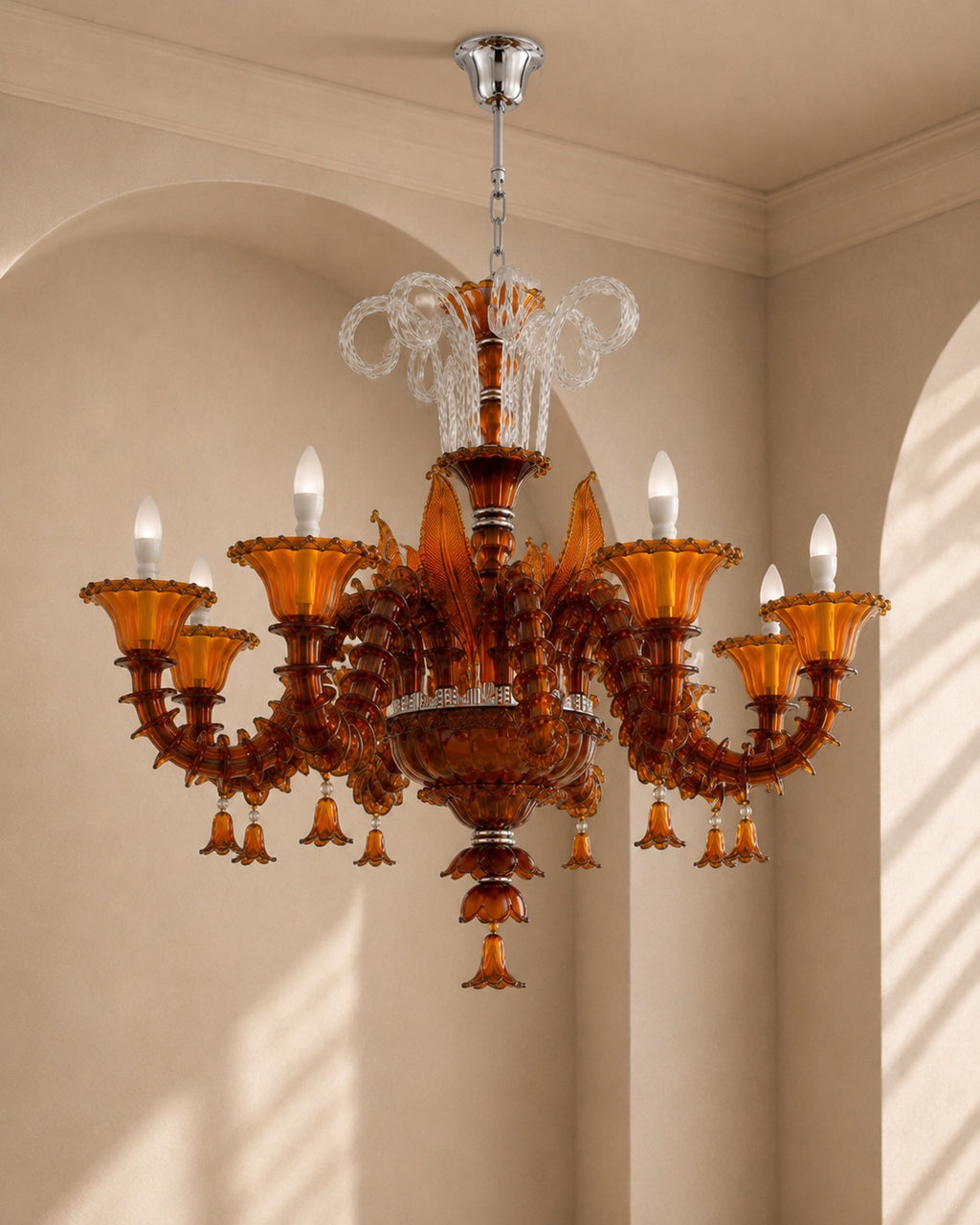 An ornate amber glass chandelier with six candle-style lights and clear crystal accents, hanging in a beige arched room.